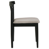 Close-up view of chair back's gently arched top rail