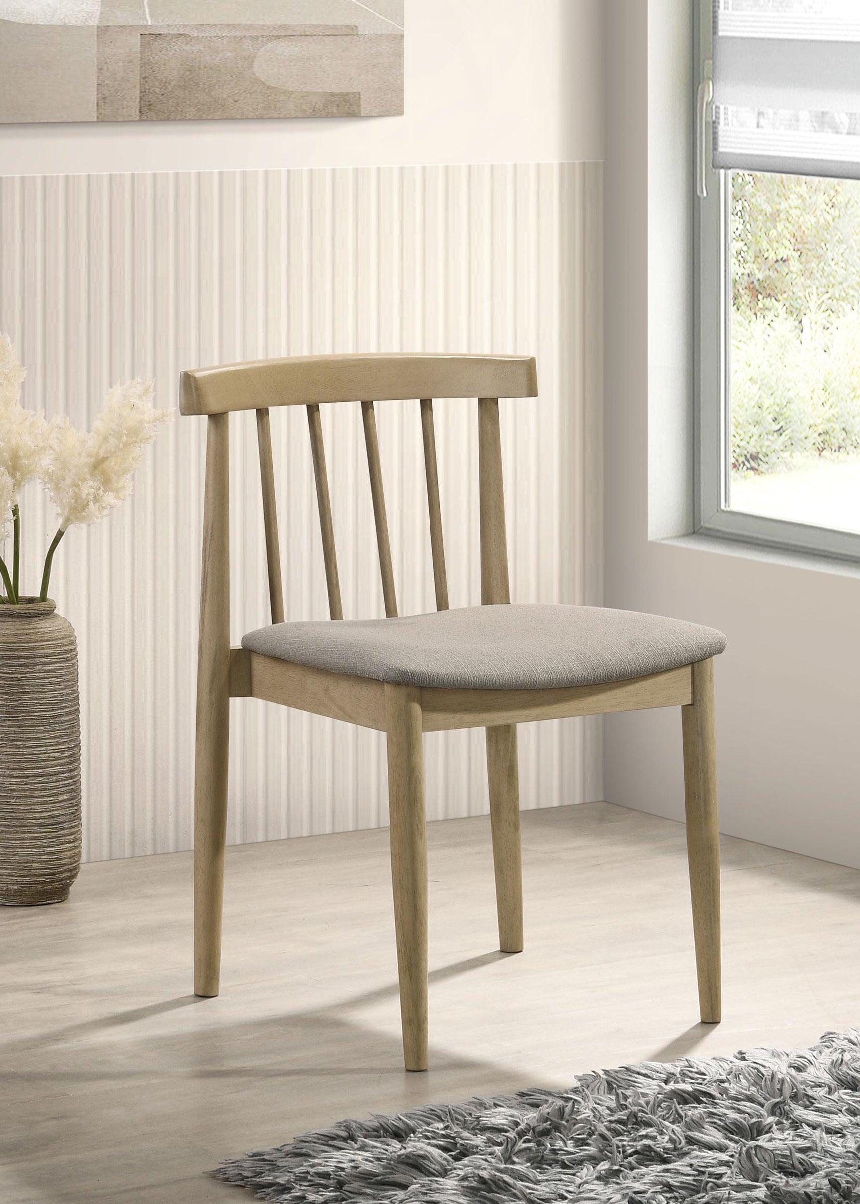 Side view of Cullen dining chair showing curved spindle back and tapered legs