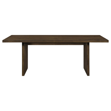 Decker dining table showing thick slab top and panel legs