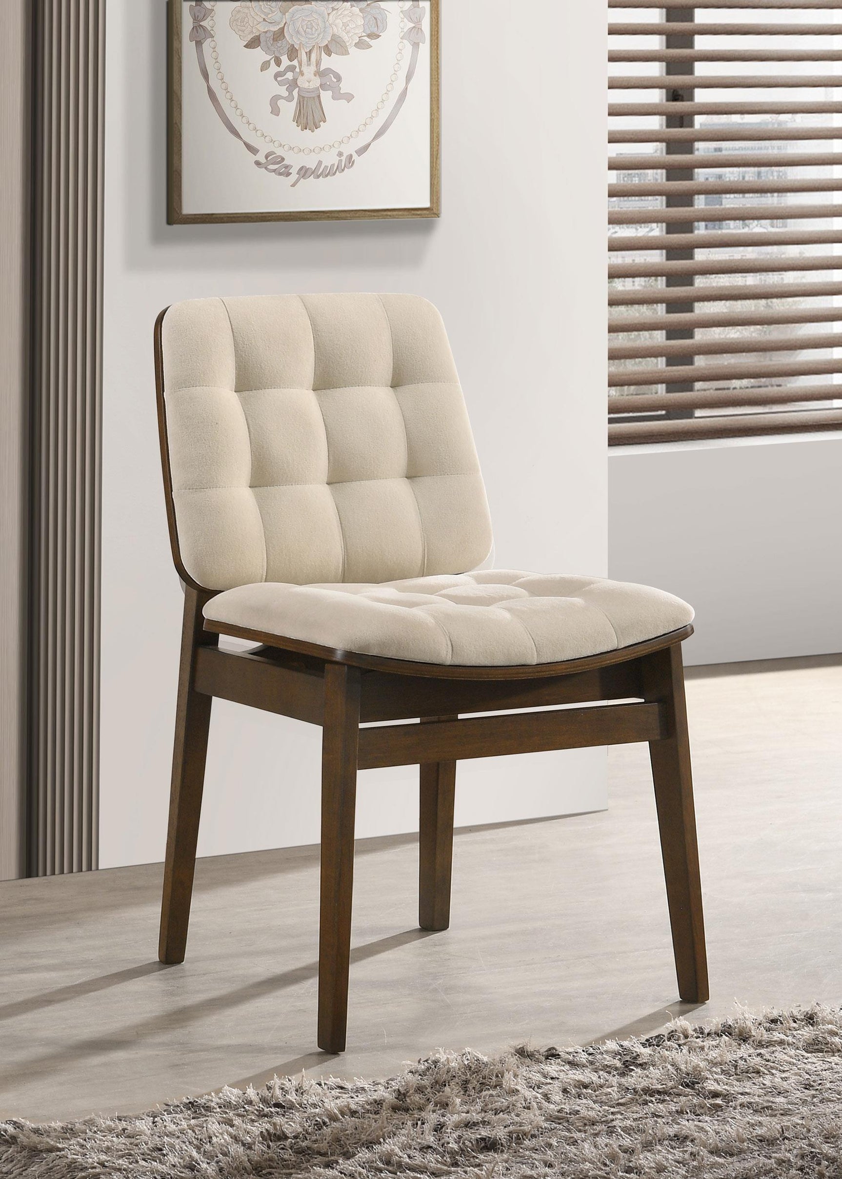 Side view of Redbridge cream velvet upholstered dining side chair with tapered walnut legs