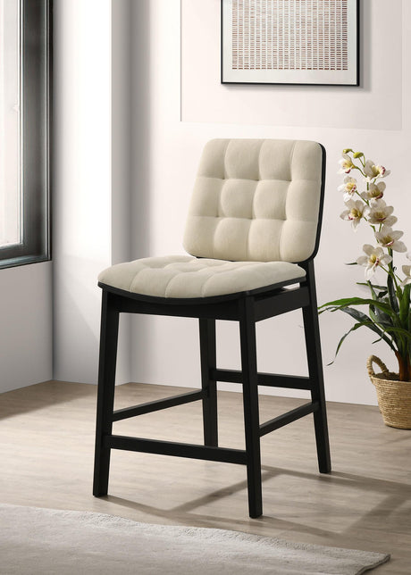 Close-up of channel tufted velvet seat in cream