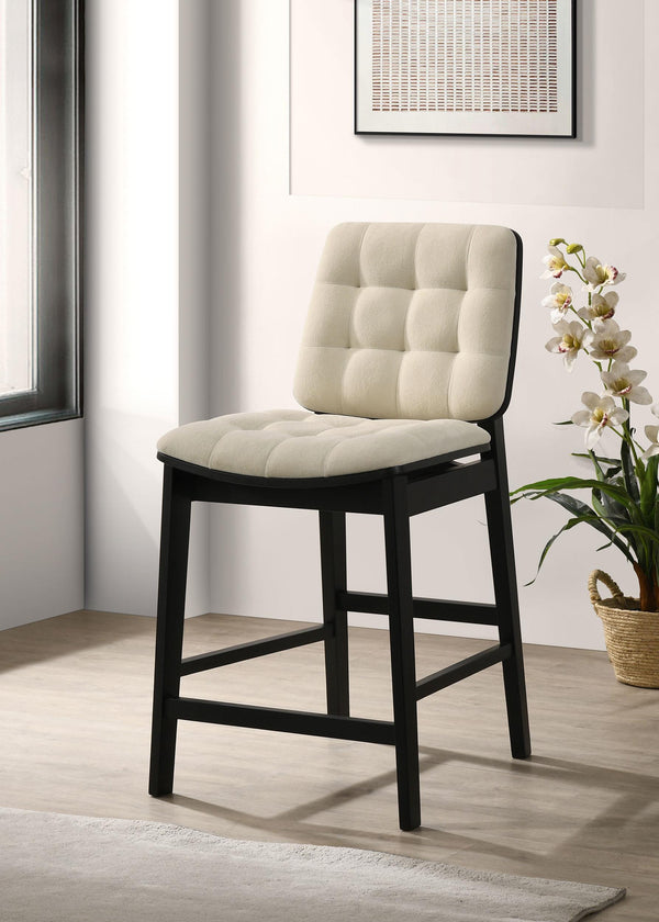 Close-up of channel tufted velvet seat in cream
