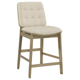 Side view of Redbridge cream velvet counter chair showing tapered legs