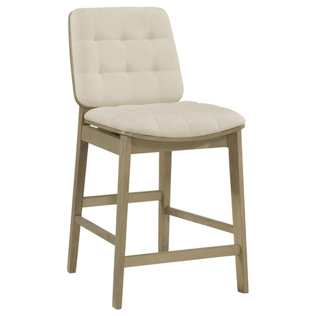 Side view of Redbridge cream velvet counter chair showing tapered legs