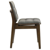 Dining room setup with Redbridge side chairs in grey velvet and walnut table