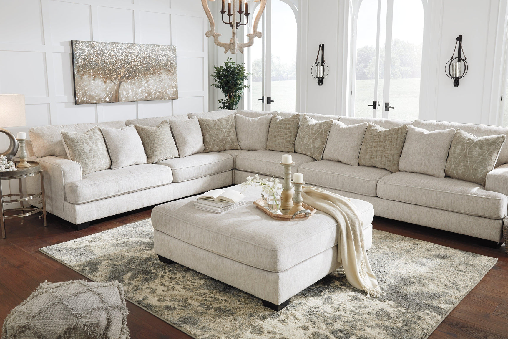 Side angle showing faux wood finish legs of Rawcliffe ottoman