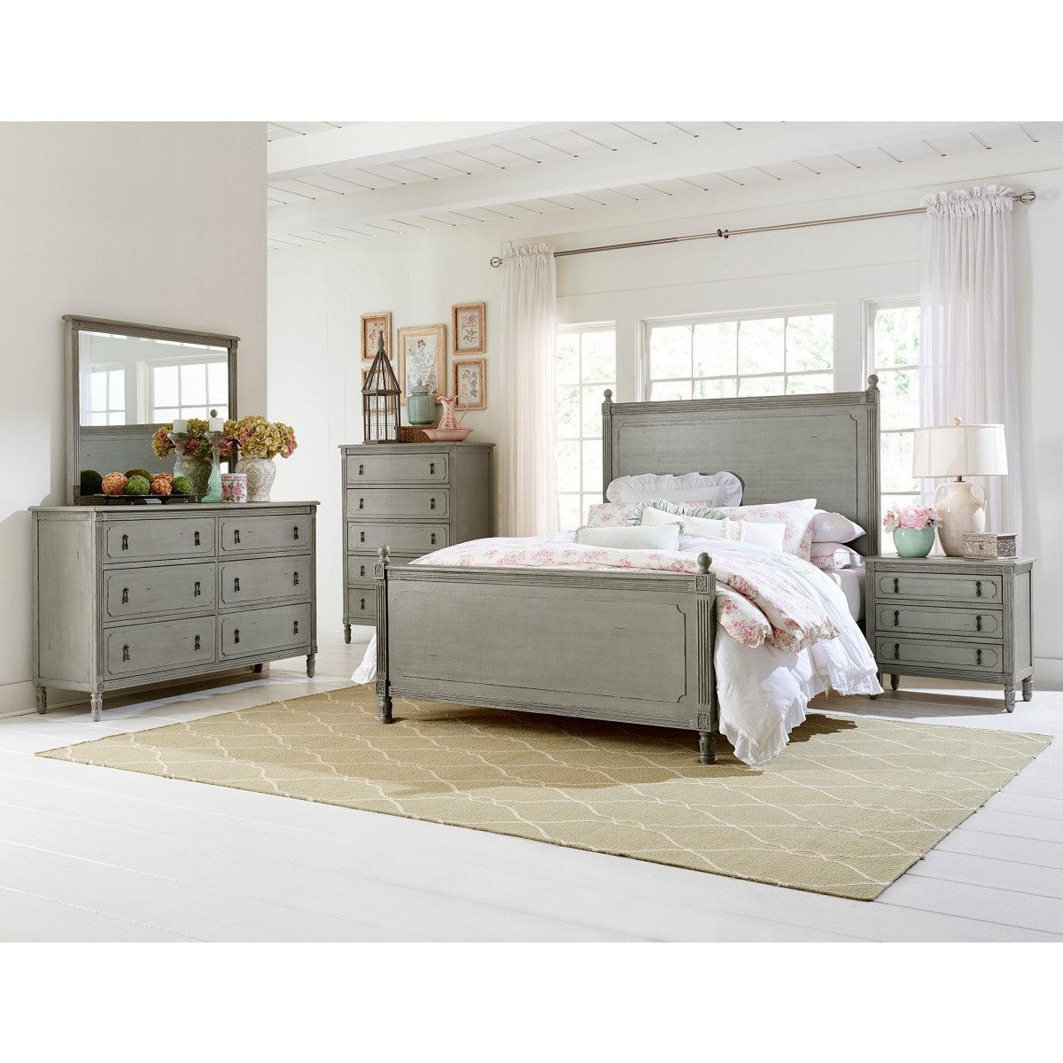 Gray panel king bed full front view in styled bedroom