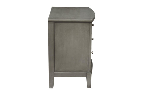 angled view of Cotterill gray tufted bedroom furniture