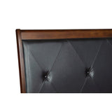 Close-up of tufted black faux leather headboard with button details on Cotterill bed