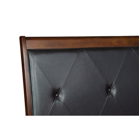Close-up of tufted black faux leather headboard with button details on Cotterill bed