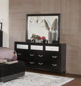 Black velvet queen bed with nailhead trim at Decor Furniture