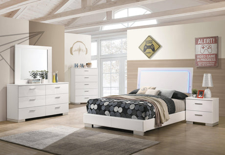 Felicity Full Size Panel Bed side angle showing padded leatherette base and chrome block feet