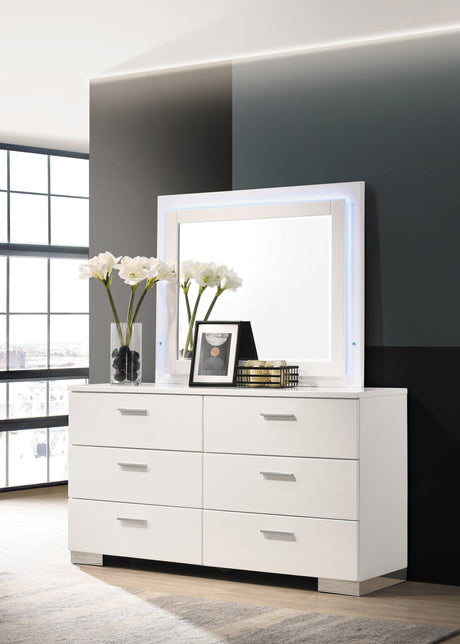 High gloss white finish detail on dresser mirror frame