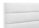 Bed headboard detail with stitching and foam upholstery