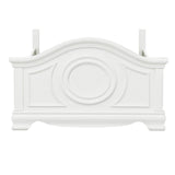 Close-up of bed frame corner with white finish and molding detail