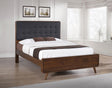Close-up of tufted upholstered headboard on Robyn Wood Full Bed