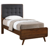 Tufted fabric upholstered headboard of Robyn Wood twin bed