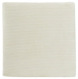 Close-up of ivory velvet fabric texture on ottoman