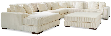 Side view of Lindyn Ivory 6-Piece Sectional with Ottoman