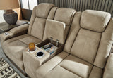 Console storage compartment in Next-Gen DuraPella Sand Faux Leather Loveseat