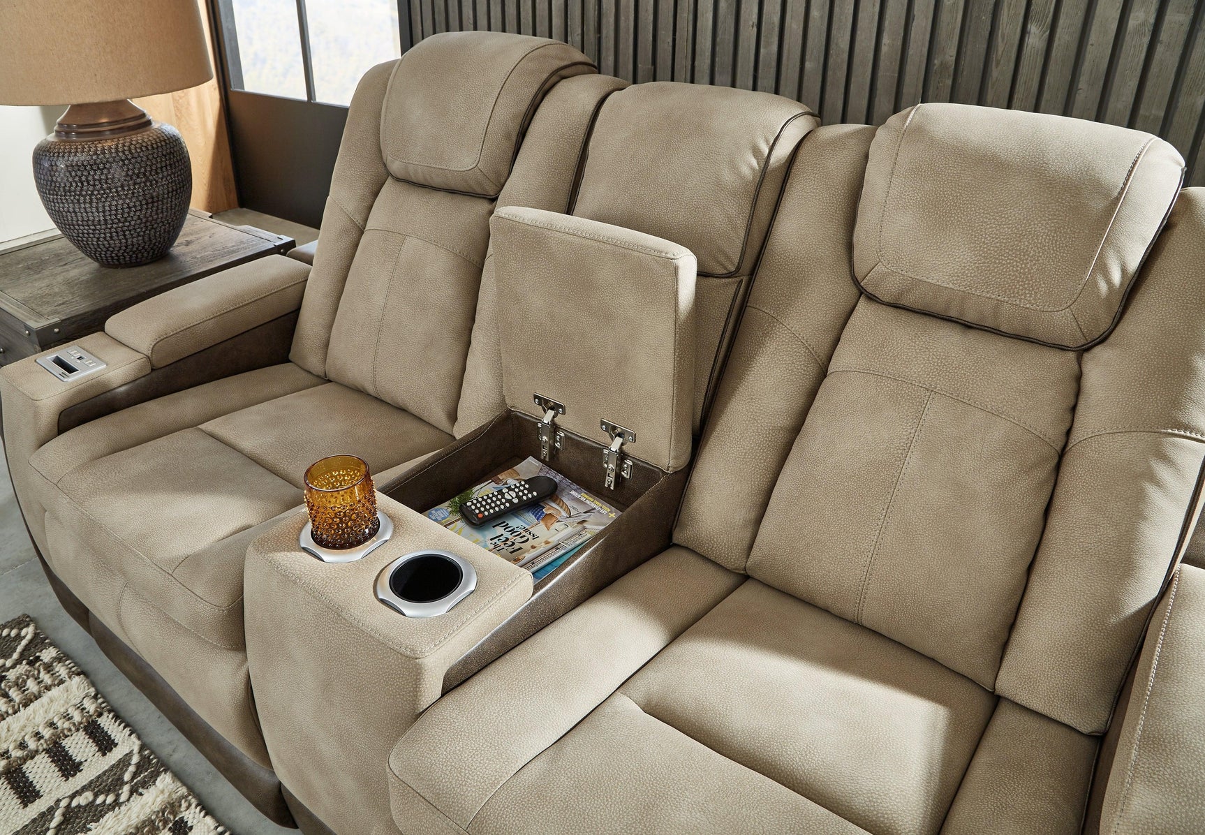 Console storage compartment in Next-Gen DuraPella Sand Faux Leather Loveseat