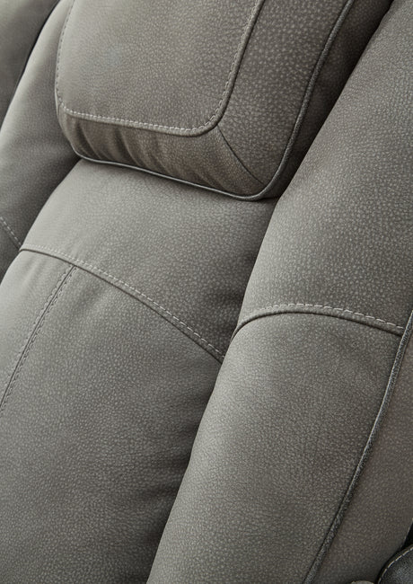 Extended ottoman footrest on sofa