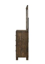 Close-up of Woodmont mirror frame showing rustic golden brown finish