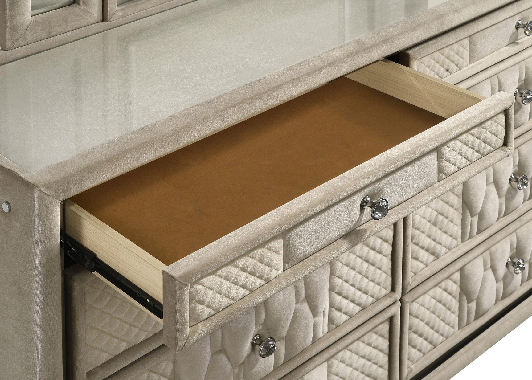 Reflective acrylic accents on drawer fronts