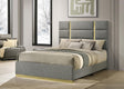 Side view of Ines Eastern King panel bed showing gold base detail and fabric upholstery