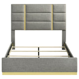 Footboard with gold base detail on Ines upholstered queen panel bed