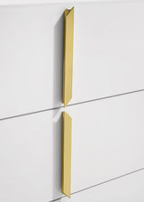 Polished gold pull closeup on drawer front