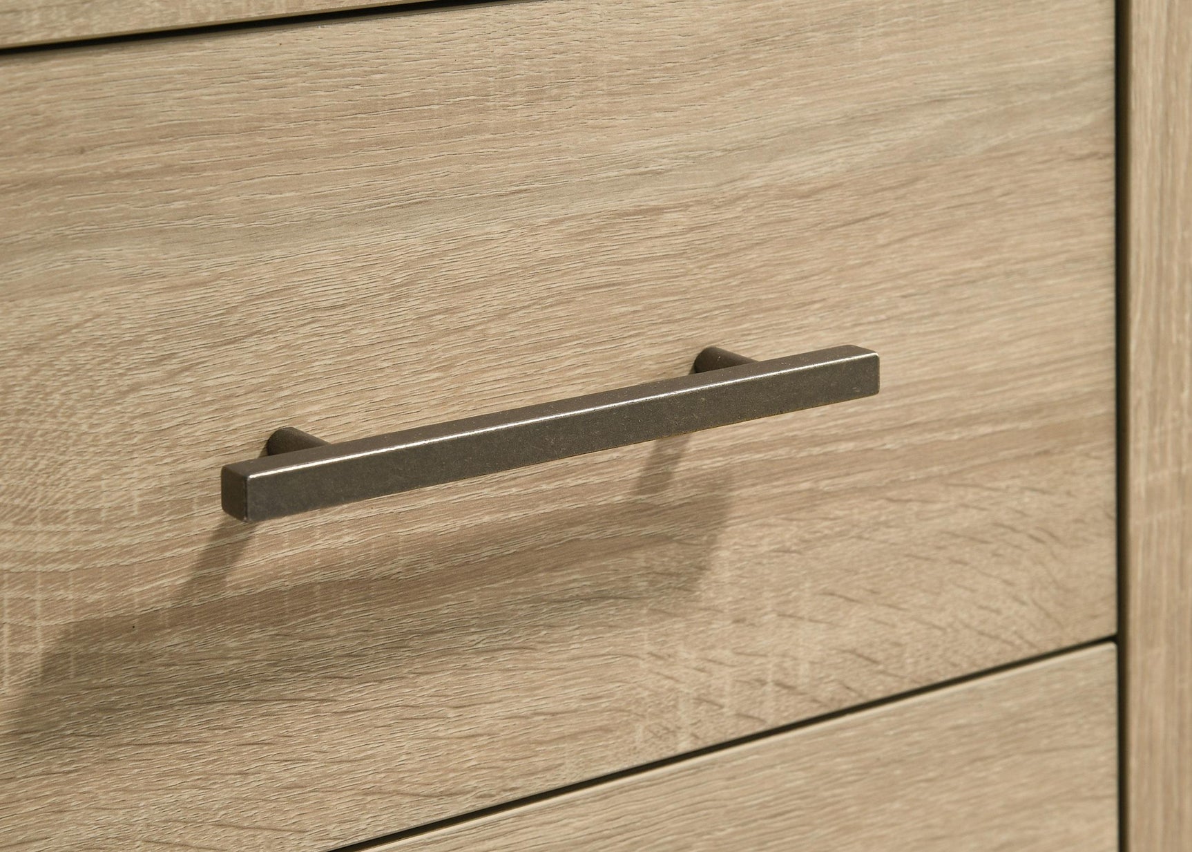 Nightstand positioned next to bed in bedroom setting