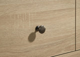 Engineered wood grain detail on dresser surface