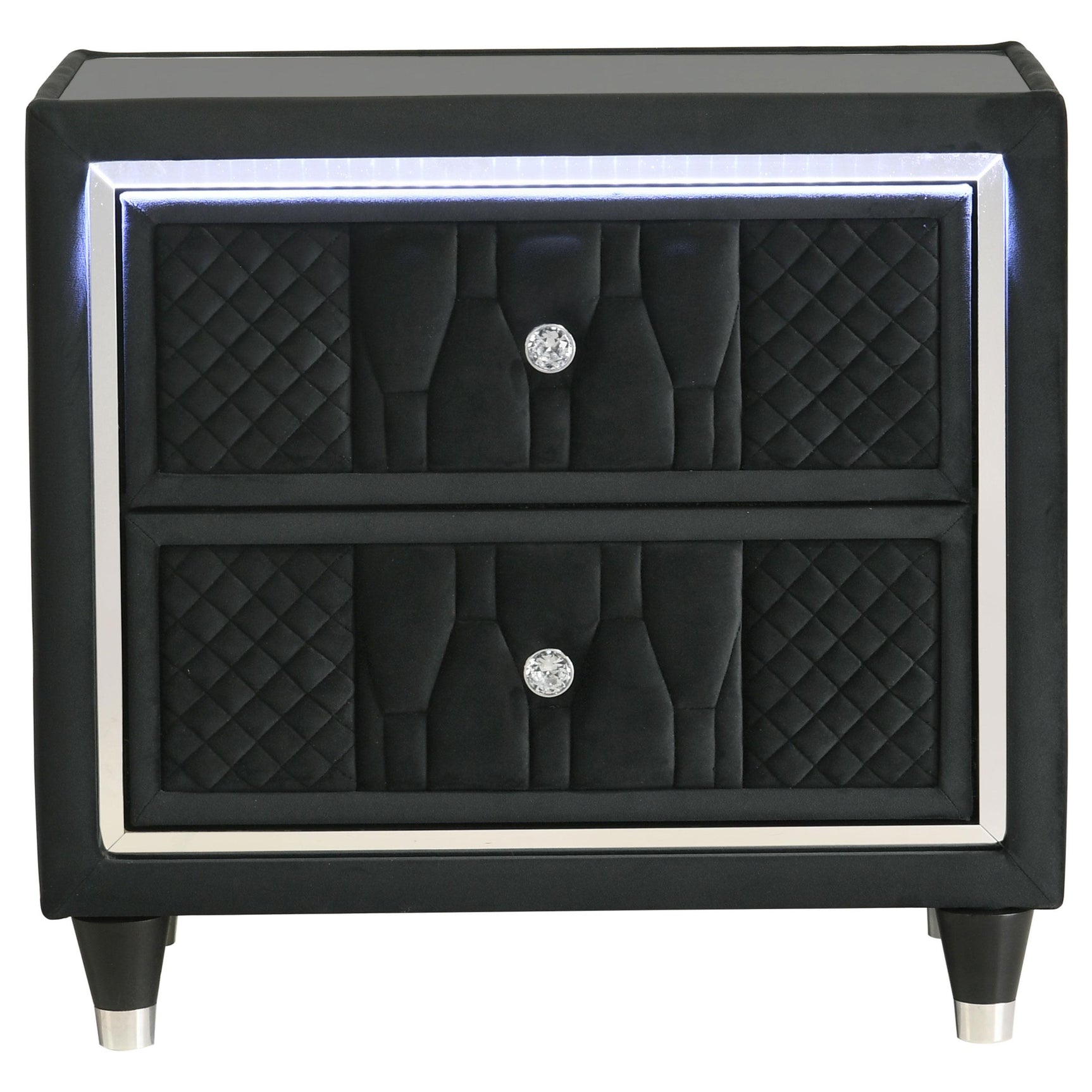 Close-up of quilted black velvet upholstery and crystal knobs