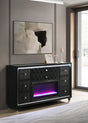 Close-up of LED flame visualizer behind clear tempered glass on dresser