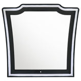 Close-up of black velvet fabric and foam padding on dresser mirror