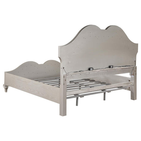 Slender tapered legs and under-bed clearance of Evangeline bed