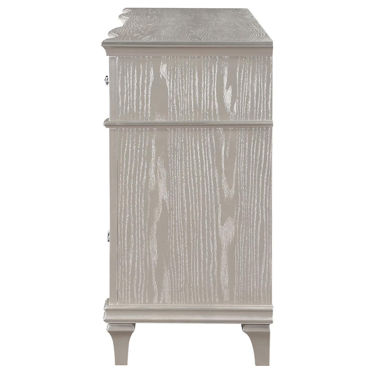 Close-up of curved facade and column panels on dresser front
