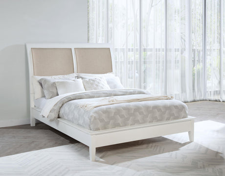 Side view of Bexhill 56-inch upholstered queen panel bed in white