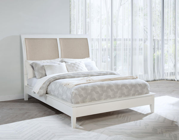 Side view of Bexhill 56-inch upholstered queen panel bed in white
