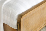 Close-up of woven natural cane panel detail on headboard