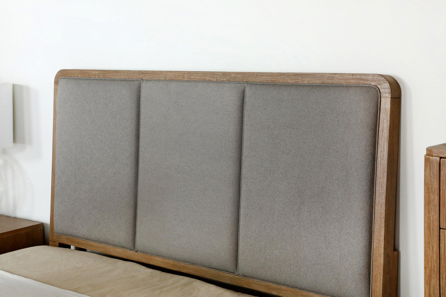 Arini Upholstered Eastern King Panel Bed in Sand Wash and Grey, side view