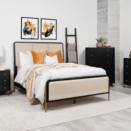 Close-up of aged brass metal legs on Arini Eastern King Panel Bed