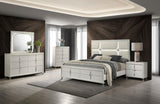 Pearl white nightstand with decorative items