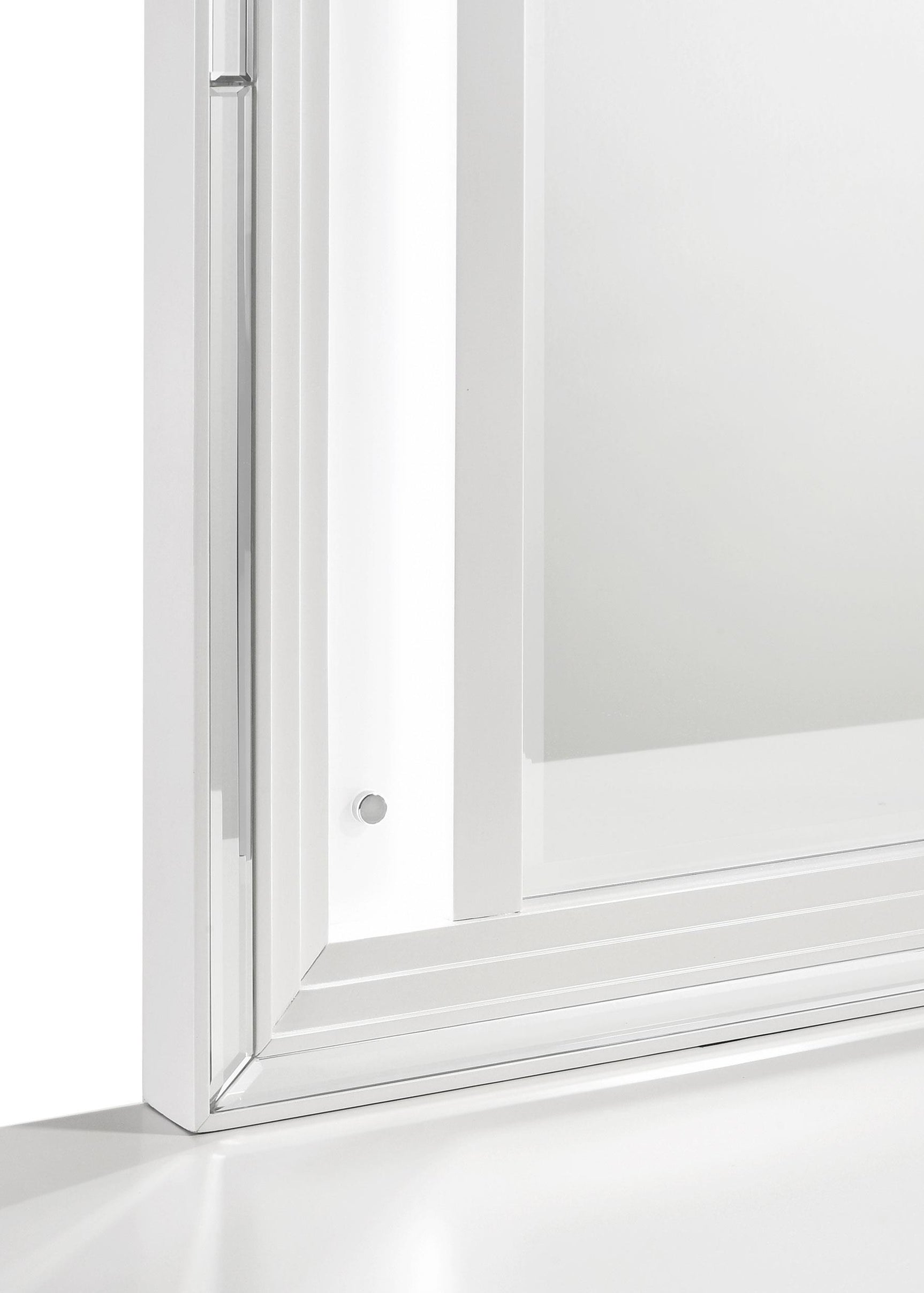 White framed dresser mirror in bedroom setting
