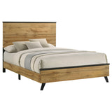 Side angle of Kaywood Eastern King Panel Bed with visible matte black metal accents