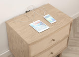 Close-up of antique brass hardware and beige oak finish on Kailani nightstand