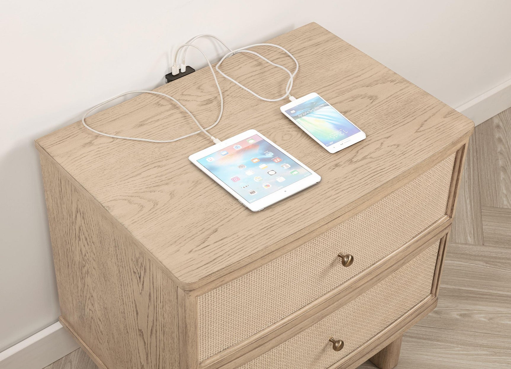Close-up of antique brass hardware and beige oak finish on Kailani nightstand