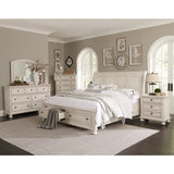 Close-up of antique white finish and turned bun feet on Bethel King Bed