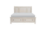 Side view of Bethel Antique White Sleigh Storage Bedroom Set bed